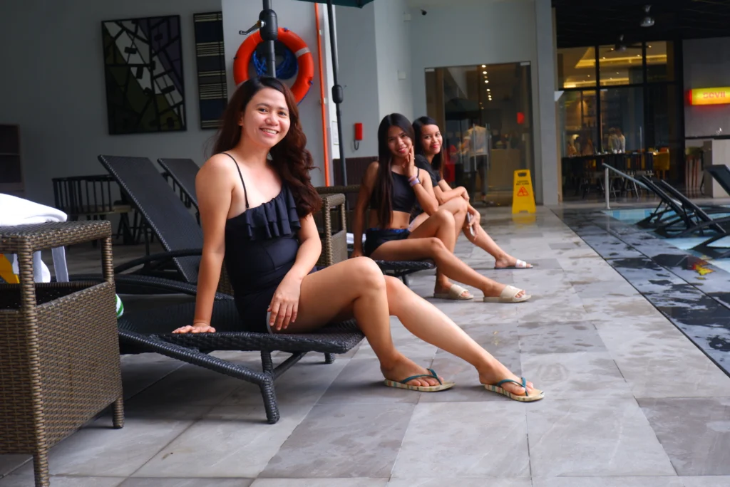 Three girls sitting in a black rattan at Holiday Inn Cebu City